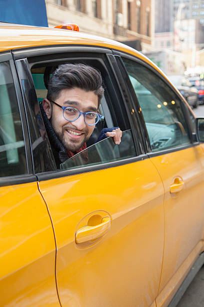 Man looking outside of taxi